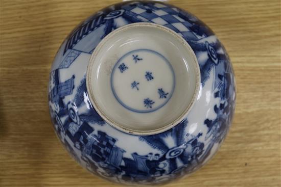 Two Chinese blue and white bowls and a famille rose bowl, 18th/19th century (3) Diameter 23cm